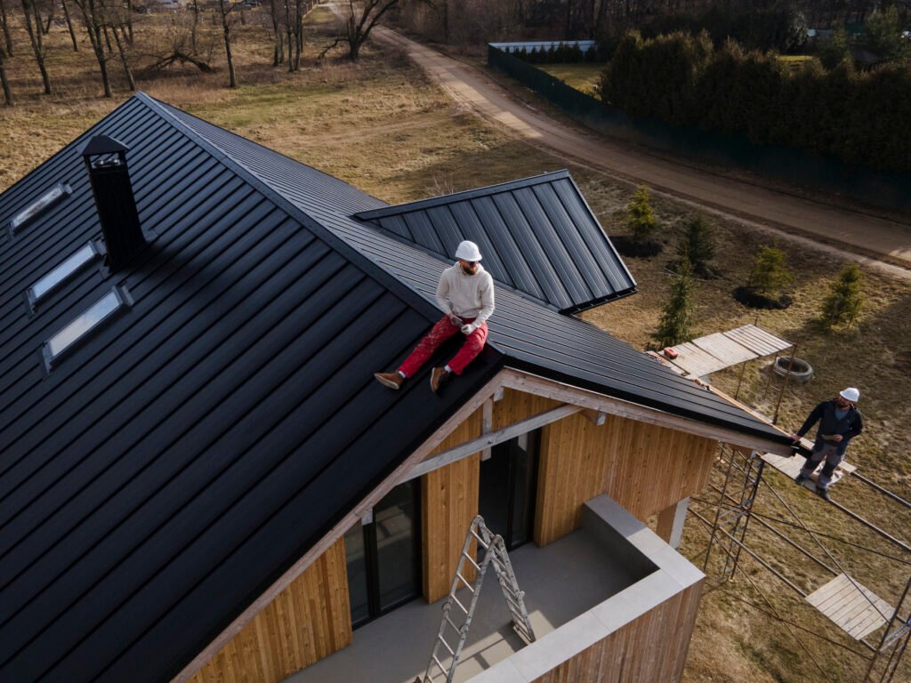man-on-roof-providing-roofing-services